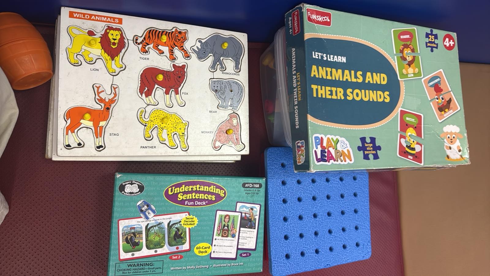 Animal picture games, matching boards and playful learning materials used in therapy